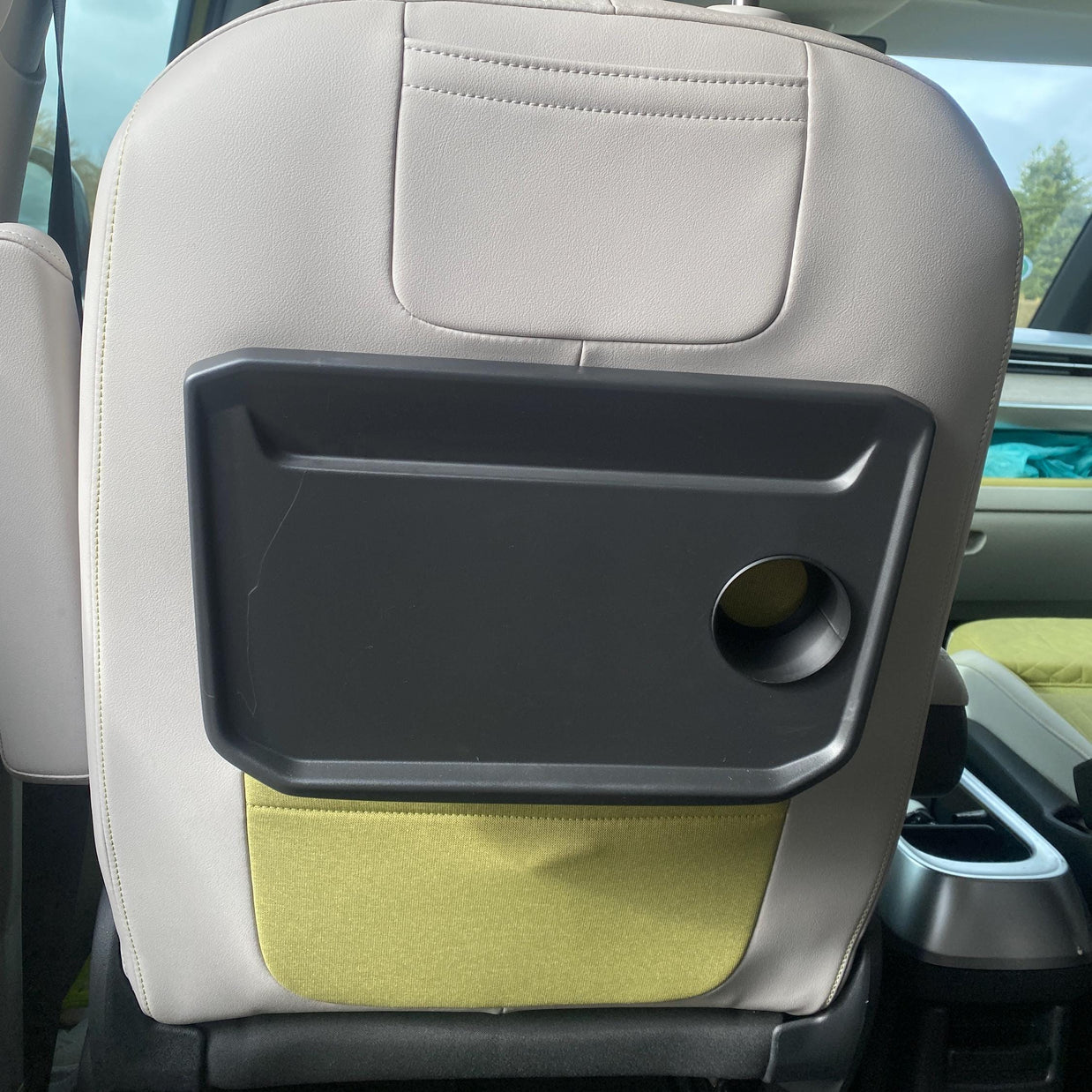 Volkswagen ID. Buzz rear seat tray with round cup hole, before cup holder insert, original tray design, space for custom 3D printed organizer, car accessory improvement, vanlife setup inspiration